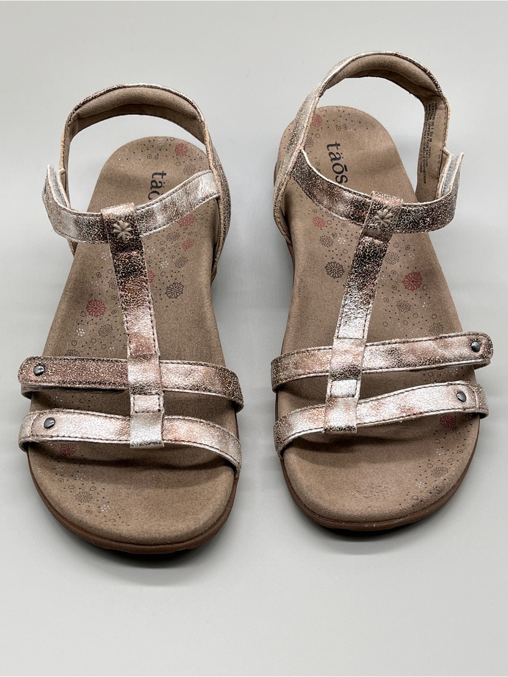 Taos Trophy 2 sandals. Size 7. Metallic champagne finish. Excellent condition.